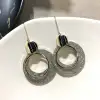 A new, minimalist pearl stud earrings featuring a unique European and American retro fashion style with shiny leather. They are trendy on Instagram for women, exuding a cool and stylish vibe Item Picture